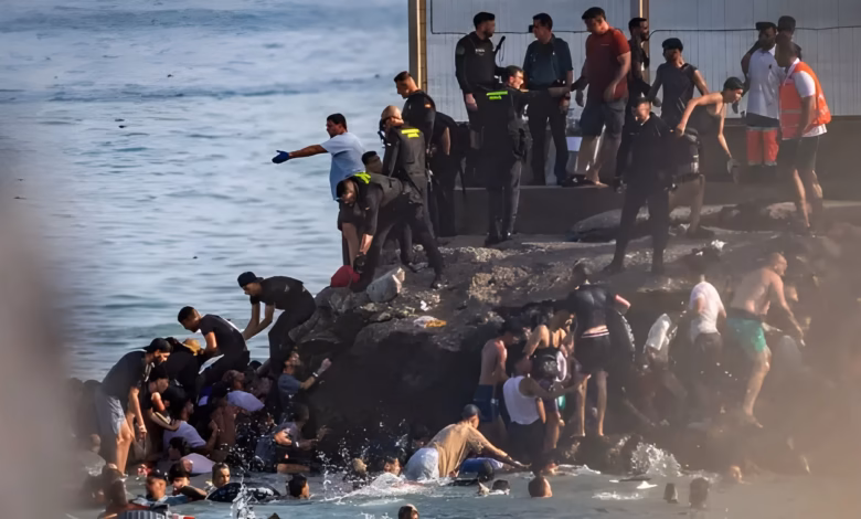 At least 18 die as thousands cross into Spain from Morocco